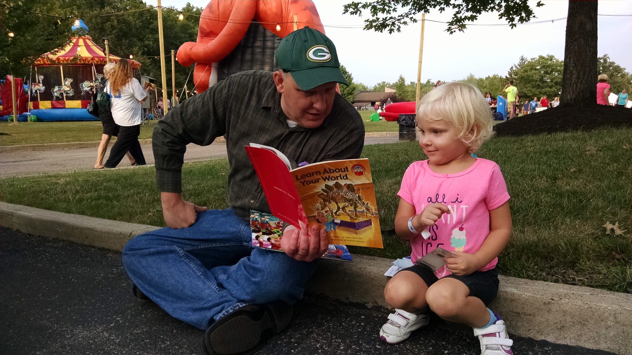 Paulina and her father break for story time during CityFest in Mentor.
