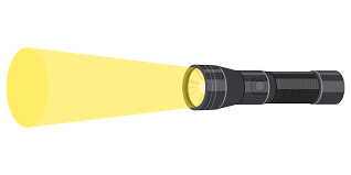 A short black flashlight is turned on with a bright light